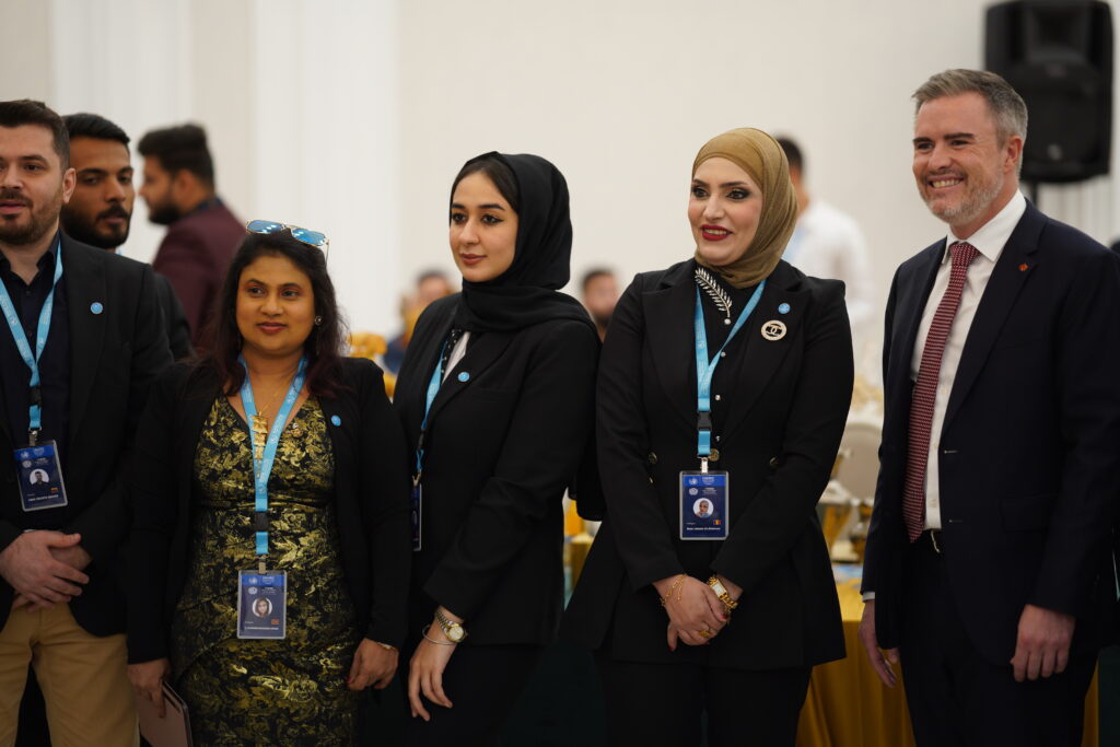 Iraqi Youth Model United Nations delegates standing next to Canada AMbassador to Iraq